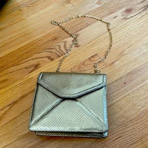 Beautiful  soft gold metallic purse with gold chain cross body